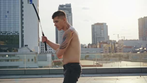 Muscular Man Tattoos Exercising Nunchaku — Stock Video