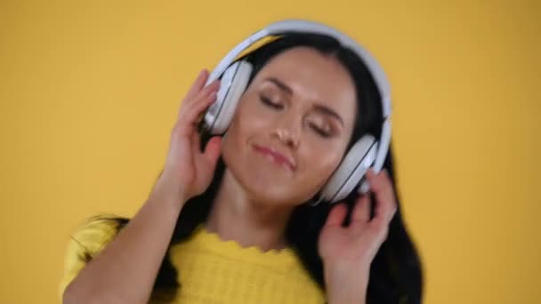 Cheerful Girl Headphones Dancing Isolated Yellow — Stock Video