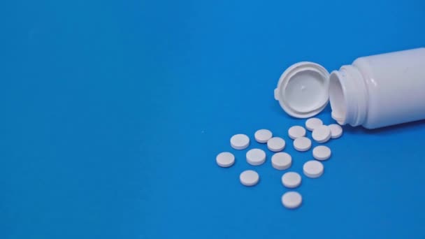 White Jar Pills Blue Background — Stock Video