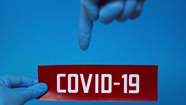 Cropped View Man Latex Gloves Pointing Covid Card Isolated Blue — Stock Video