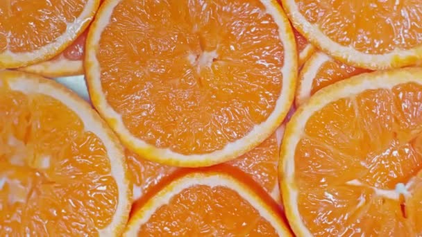 Πάνω Όψη Φρέσκων Ώριμων Φέτες Πορτοκαλιού — Αρχείο Βίντεο