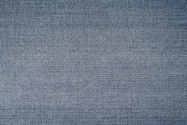 Fondo texturizado denim azul. Textura de primer plano y patrón de tejido vaquero —  Fotos de Stock