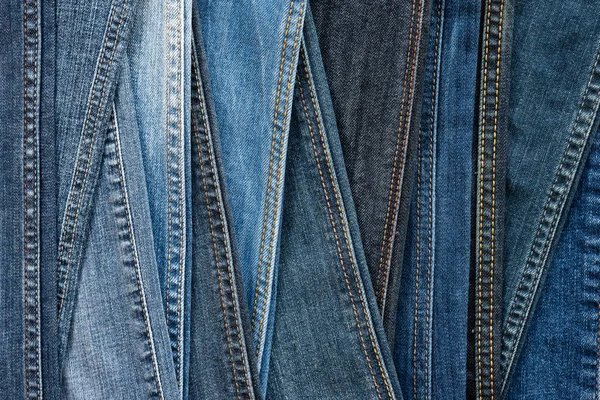 Denim achtergrond. Blauwe jeans naden van verschillende tinten en texturen. — Stockfoto