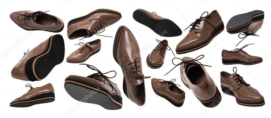 Set of brown patent leather shoes in different positions and angles isolated on white background. Banner. Flying or levitating objects. Women's fashion shoes concept.