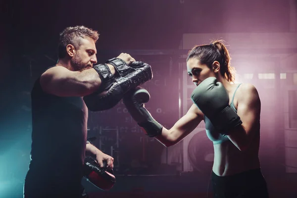 Male Trainer Gives Self Defense Classes To Female Fighter Uppercut Short Boxing Training Athletic Hematoma Stock Photo Male Trainer Gives Self Defense Classes To Female Fighter Uppercut Short Boxing Training Athletic Hematoma Stock Photo
