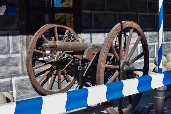 Antique metal cannon on big wheels in Europe — Stock Photo, Image