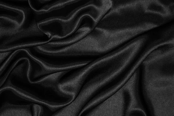 滑らかなエレガントな黒シルクやサテンの高級布テクスチャは 抽象的な背景として使用することができます 縮れ布 — ストック写真