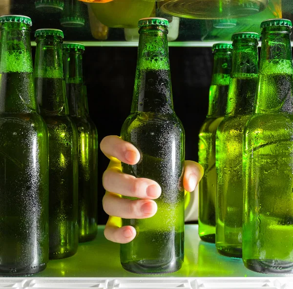 Hand Reaches Beer Bottle Green Bottles Beer Drops Condensation Shelf — Stock Photo, Image