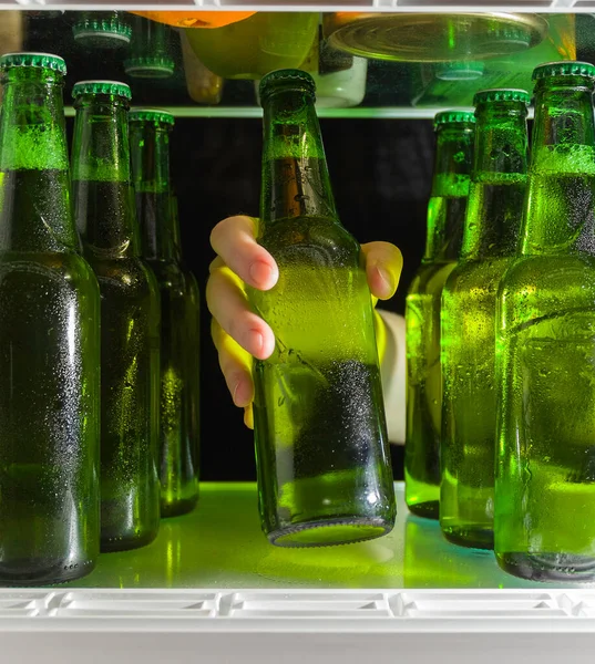 Hand Reaches Beer Bottle Green Bottles Beer Drops Condensation Shelf — Stock Photo, Image