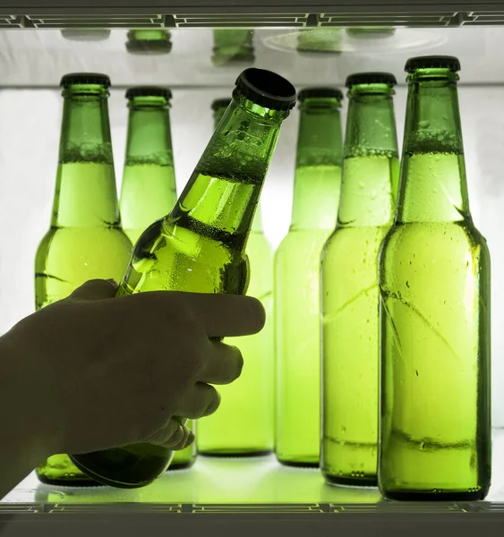 Green Beer Bottles Chilled Drops Water Shelf Refrigerator Hand Takes — Stock Photo, Image