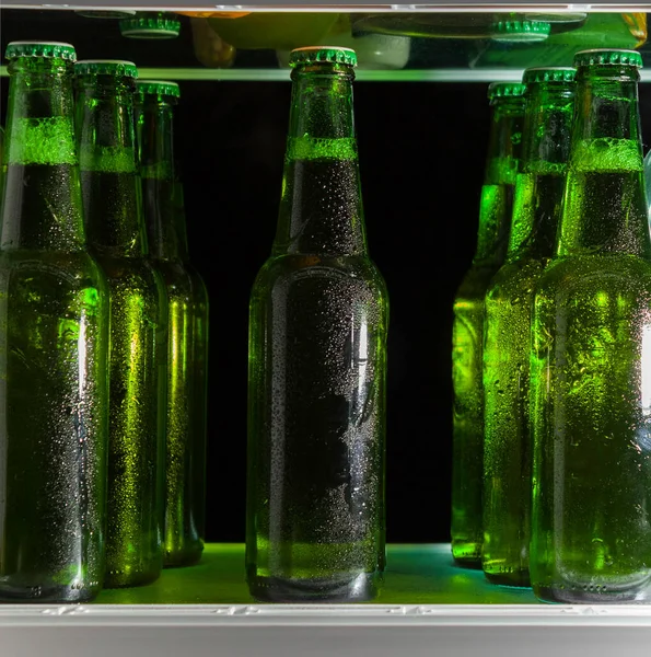 Green Beer Bottles Shelf Refrigerator Fog Glass — Stock Photo, Image