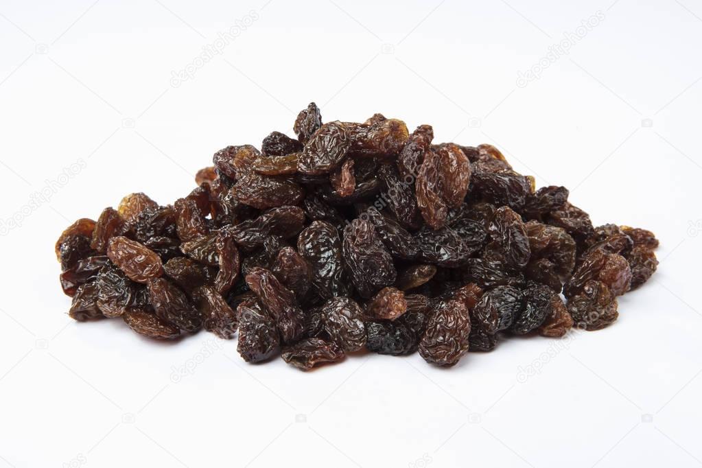 Heap of raisins isolated on white background