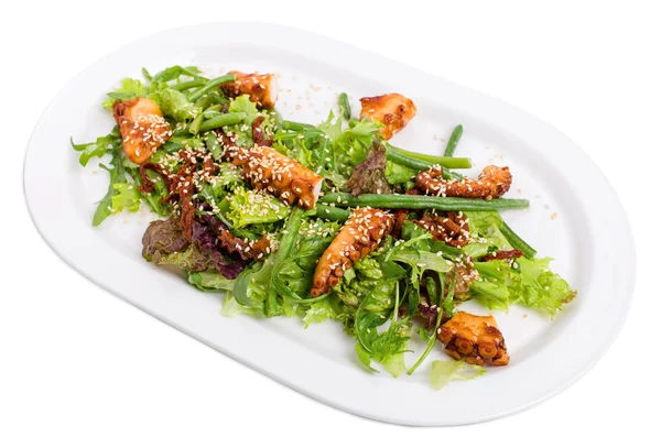 Salad with grilled octopus and dried tomatoes. — Stock Photo, Image