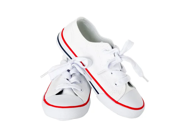 Взуття на білому полотні з червоною смугою . — стокове фото