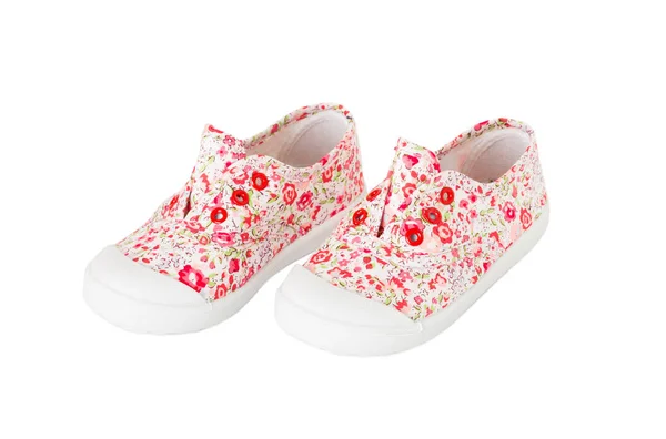 Πάνινα παπούτσια ροζ κορίτσι μωρό με άνθη μοτίβο. — Φωτογραφία Αρχείου