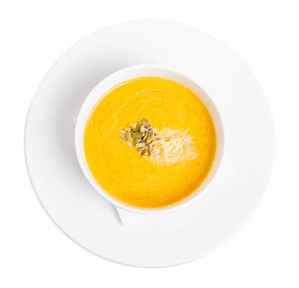 Pumpkin cream soup with grated cheese. — Stock Photo, Image