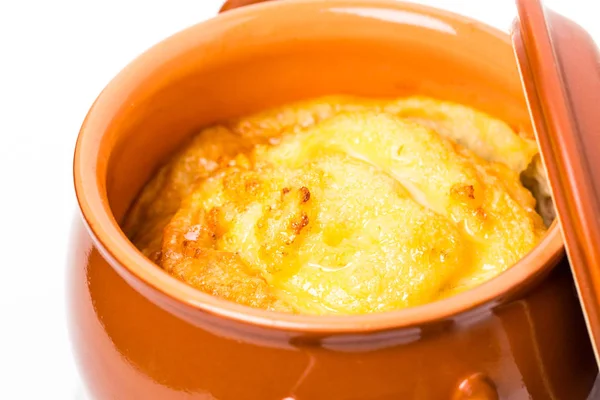 Pork sausages on crock pot with cheese. — Stock Photo, Image