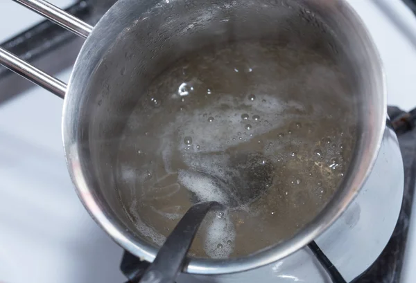 Melted gelatin in metal pot. — Stock Photo, Image