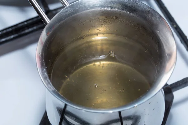 Melted gelatin in metal pot. — Stock Photo, Image