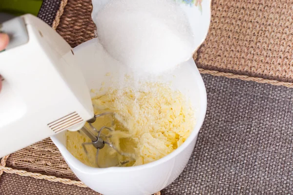 Mixing butter in white bowl. — Stock Photo, Image