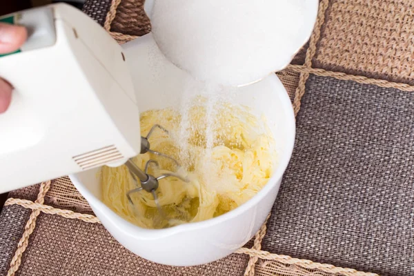 Mixing butter in white bowl. — Stock Photo, Image
