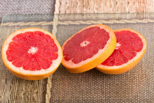 Sliced fleshy red grapefruit. — Stock Photo, Image