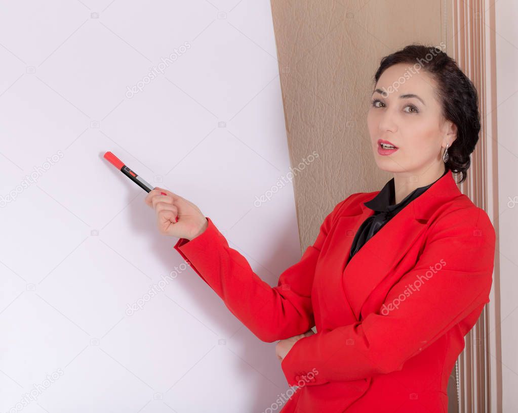 Business woman explaining at the whiteboard.