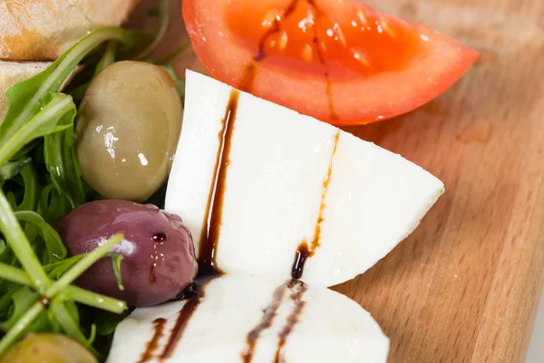 Starter platter with mozzarella and olives. — Stock Photo, Image