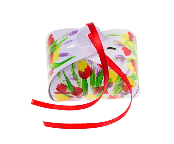 Painted gift box with red ribbon. — Stock Photo, Image