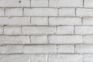Eski beyaz tuğla duvar.