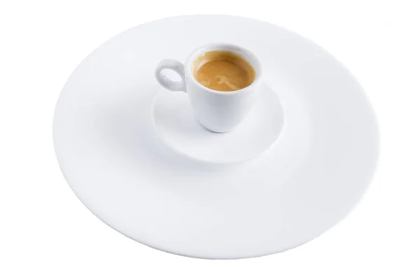 Uma xícara de café em um pires e um prato . — Fotografia de Stock