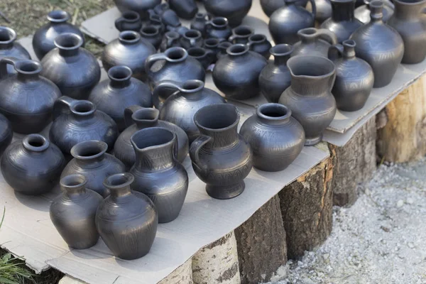 Stone dark jugs. — Stock Photo, Image