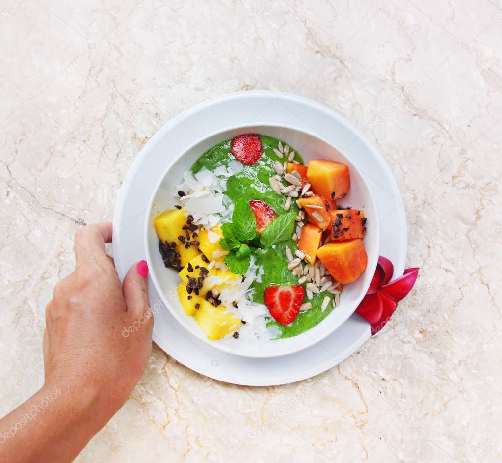 Healthy breakfast made of smoothie bowls with fresh fruits
