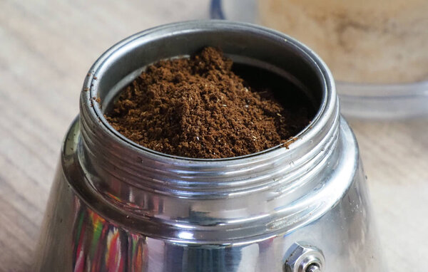 peermel coffee poured into a geyser coffee maker