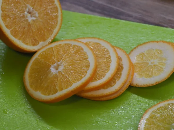 Slicing Orange Green Board — Stock Photo, Image