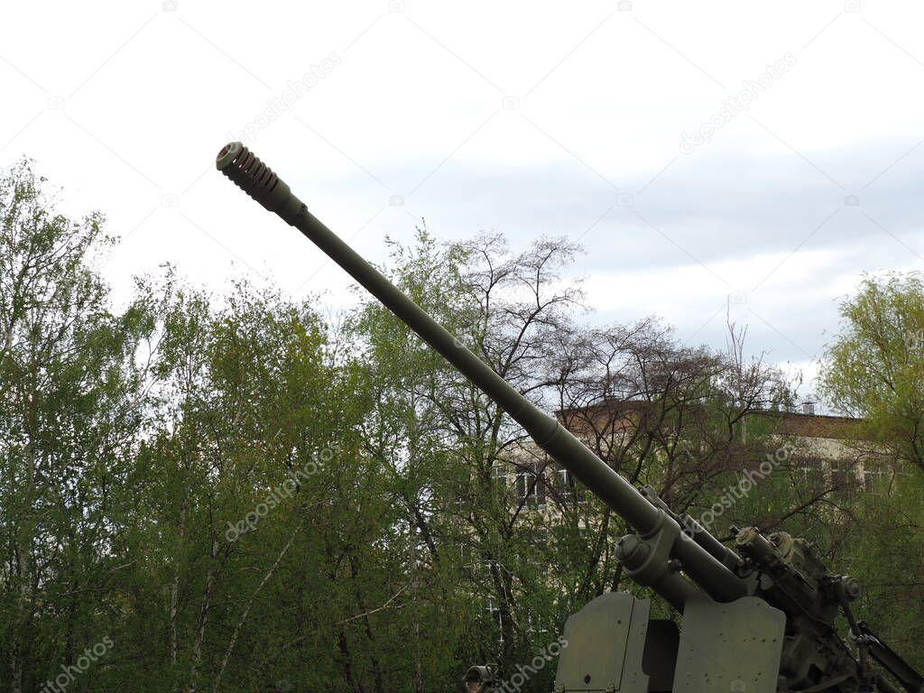 Soviet anti-aircraft gun on blue sky background. 100 mm air defense gun KS-19