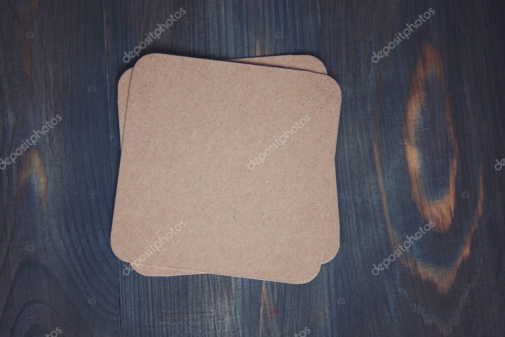 Empty blank cardboard beermat on wood mockup