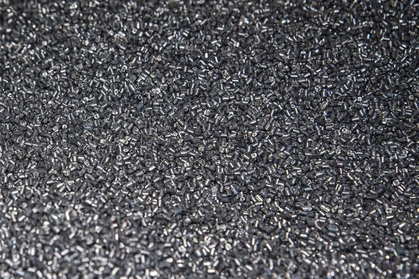 Szary tworzywo sztuczne granulki tekstury — Zdjęcie stockowe