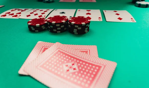 Foreground poker cards and chips in the middle of the game — Stock Photo, Image