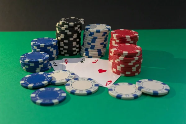 Cards and poker chips on a green table — Stock Photo, Image