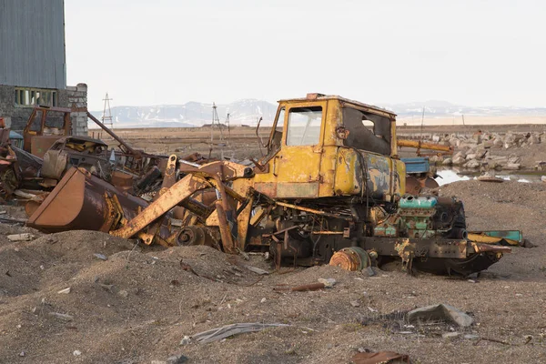 stock image The old disassembled thrown tractor