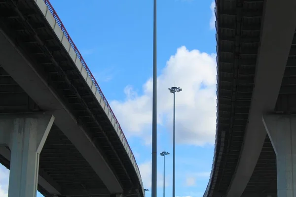 A fragment of the cable-stayed bridge. Steel masts and cables holding the roadway.