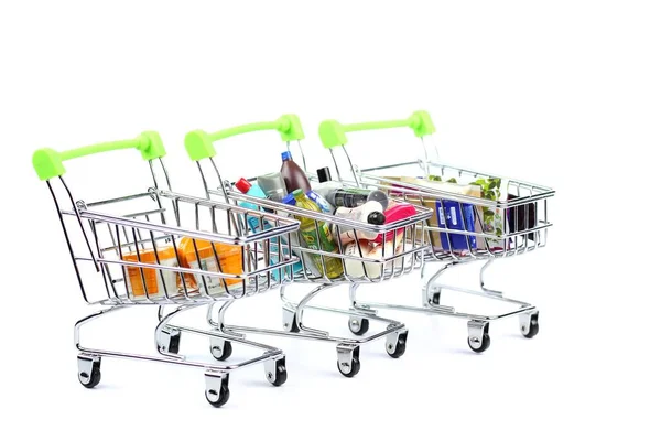 Wózki Spożywcze Produktami Jasnym Tle Zakupy Sprzedaż — Zdjęcie stockowe