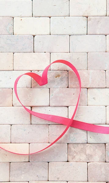 Gift ribbon in a heart shape — Stock Photo, Image