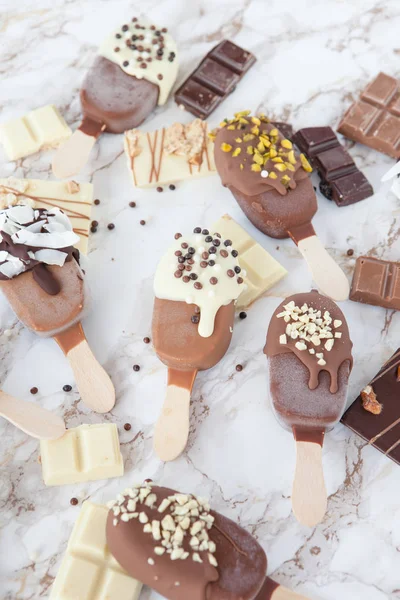 Frozen popsicles with chocolate — Stock Photo, Image