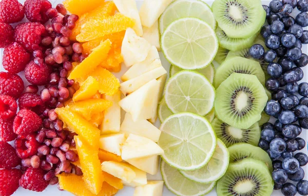 Fresh fruits in rainbow colors — Stock Photo, Image