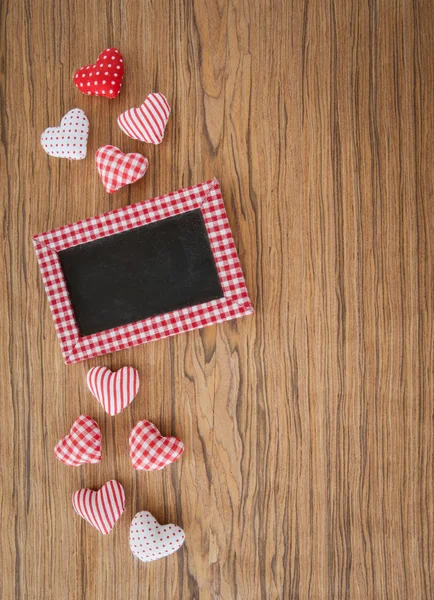 Little chalkboard on wooden background — Stock Photo, Image