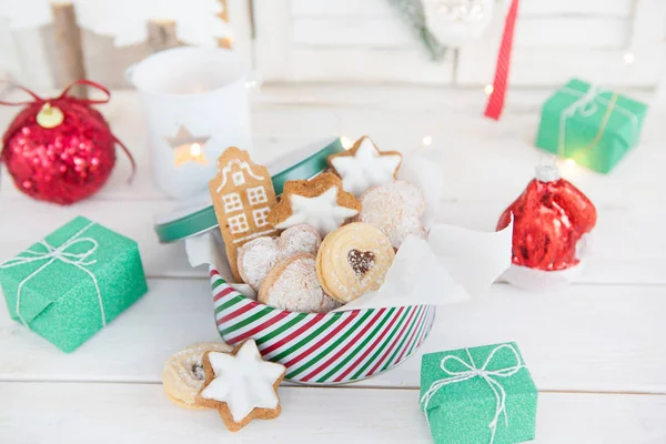 Christmas cookies in a striped cookie jar — Stock Photo, Image