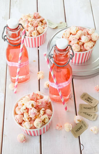 Colorful popcorn in striped cups — Stock Photo, Image