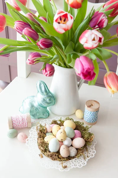 Chocolate treats and fresh tulips — Stock Photo, Image
